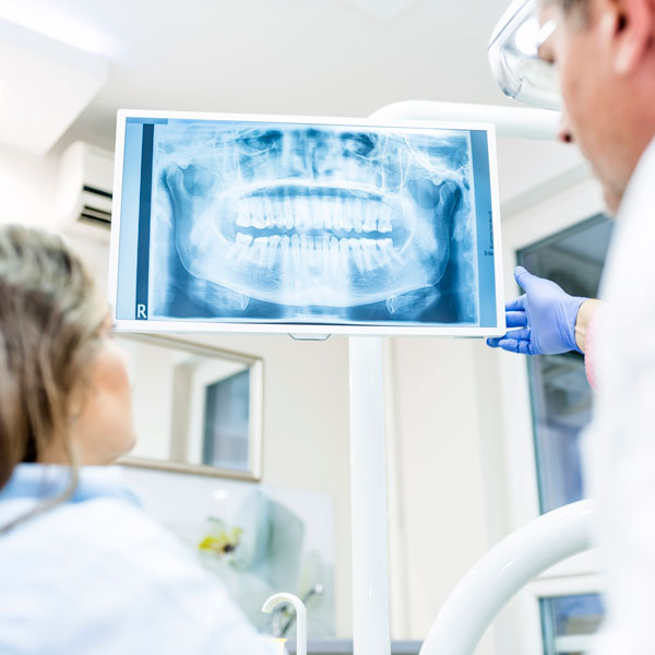 doctor and patient reviewing digital xray