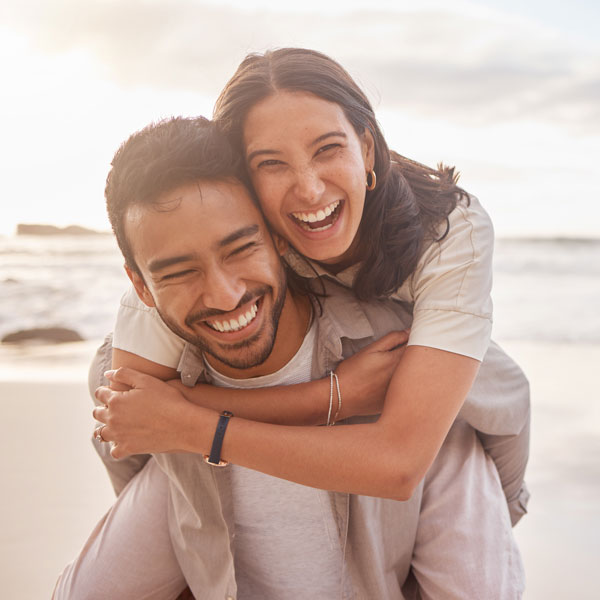 couple smiling on beach