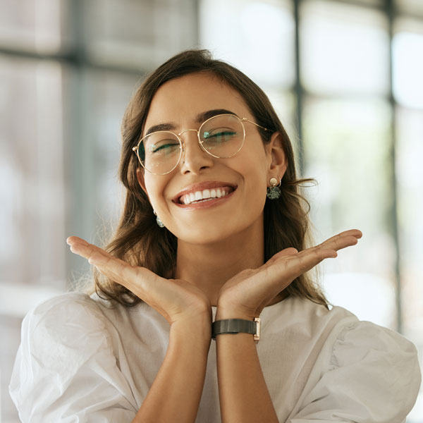 woman in glasses smiling