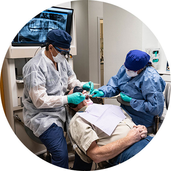 staff working on patient in exam room